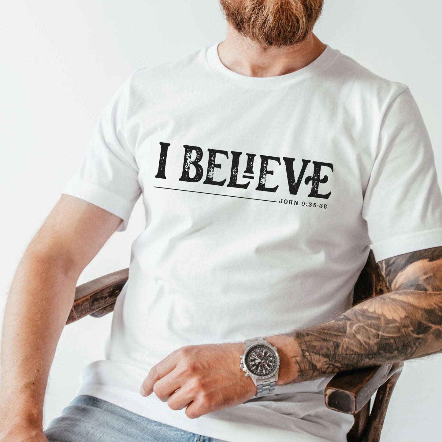 White unisex Christian t-shirt featuring distressed 'I Believe - John 9:35-38' Bible verse print in white, perfect gift for men and women expressing their faith