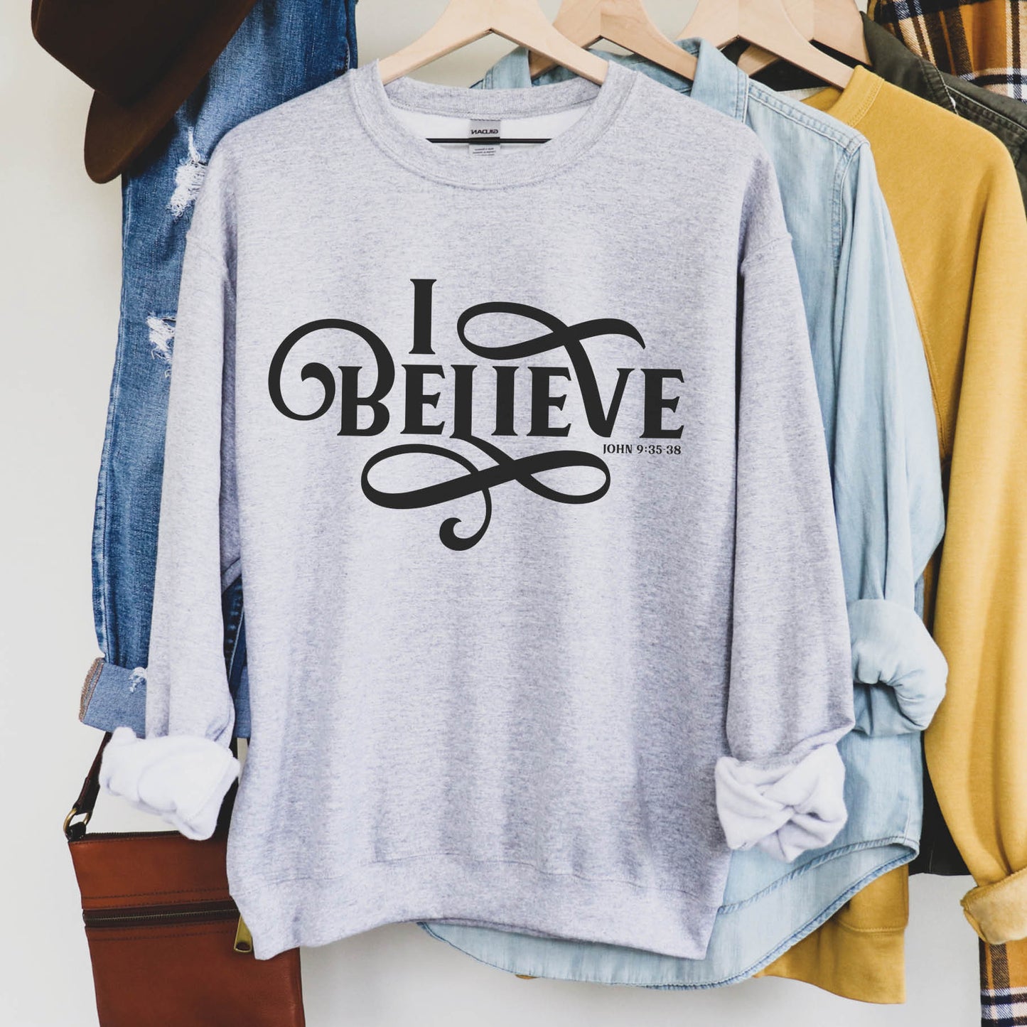 Cozy heather gray I BELIEVE John 9:35-38 bible verse women's Christian unisex sweatshirt, designed for faith-filled Jesus believers in size small, medium, large, XL, 2XL, 3XL, 4XL