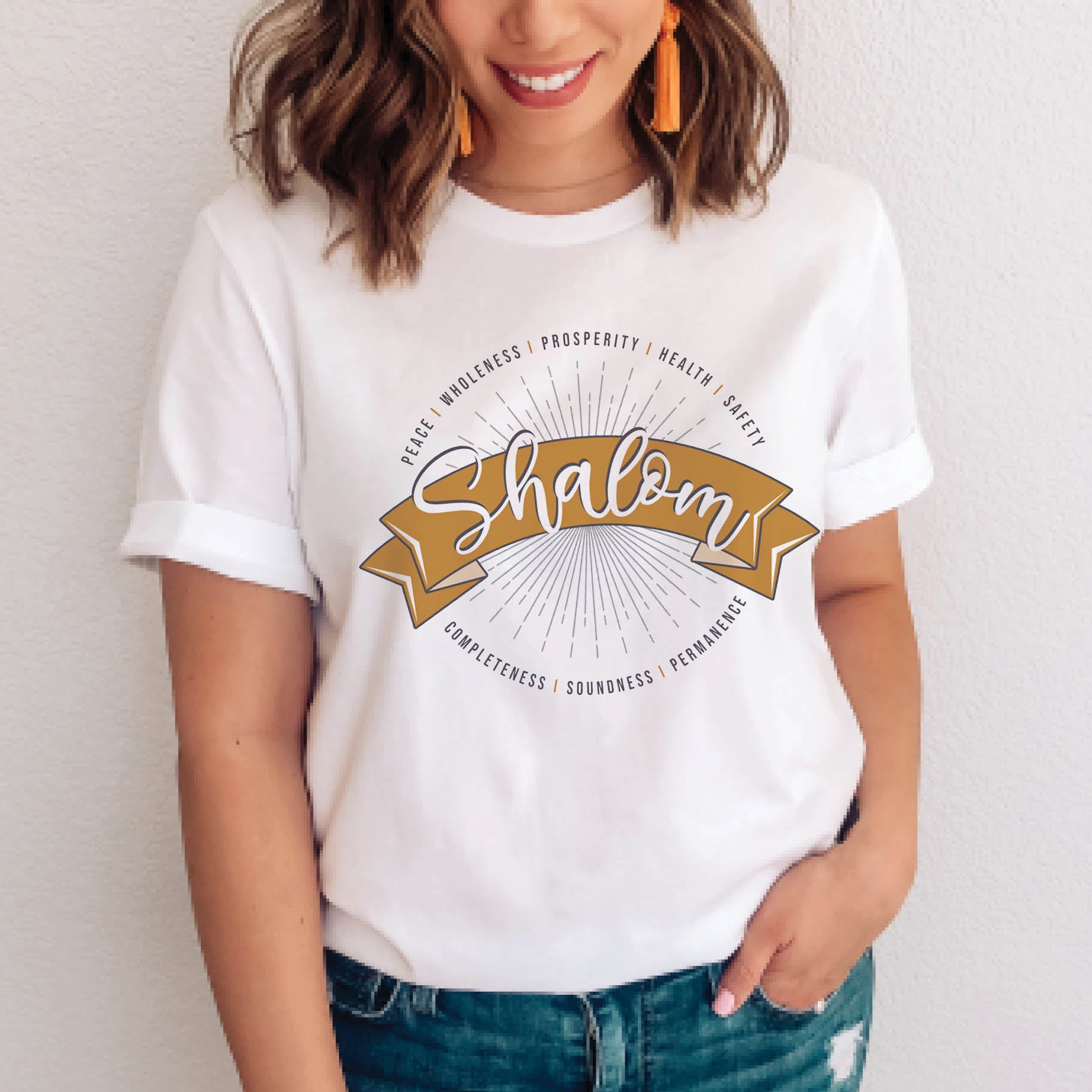 Soft white faith-based Christian women's unisex t-shirt with a gold banner and sunburst design that says the Hebrew meaning of the word "SHALOM" -  Peace, Completeness, Prosperity, Health, Safety, Wholeness, Soundness, and Permanence definition, makes a great mother's day gift for mom!