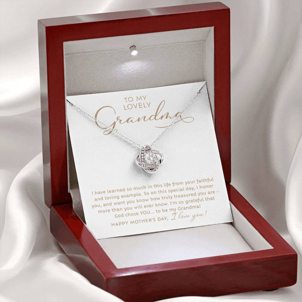 To my Lovely Grandma 14k white gold sparkling cubic zirconia Love Knot necklace Happy Mother's Day Gift to Grandmother with heart warming message card nestled inside luxury mahogany jewelry gift box