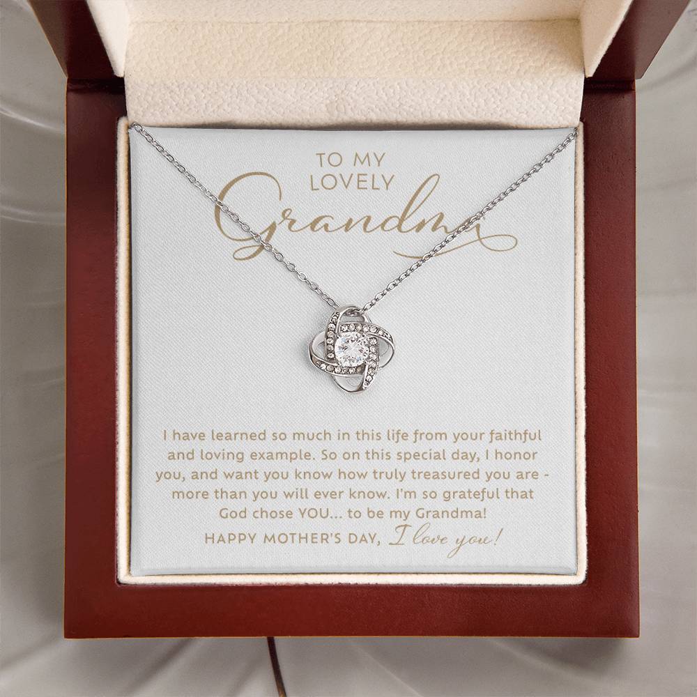 To my Lovely Grandma 14k white gold sparkling cubic zirconia Love Knot necklace Happy Mother's Day Gift to Grandmother with heart warming message card nestled inside luxury mahogany jewelry gift box