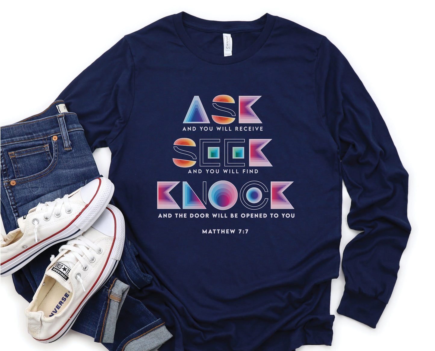 Ask Seek Knock Matthew 7:7 Christian aesthetic design printed in holographic colors on navy blue soft long sleeve tee for men & women