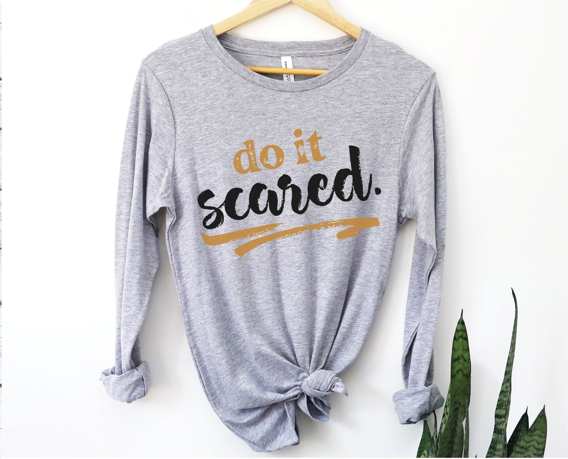 Do It Scared faith over fear 2 Timothy 1:7 do not fear bible verse Christian aesthetic design printed in black and gold on soft heather gray unisex long sleeve tee shirt for women and men