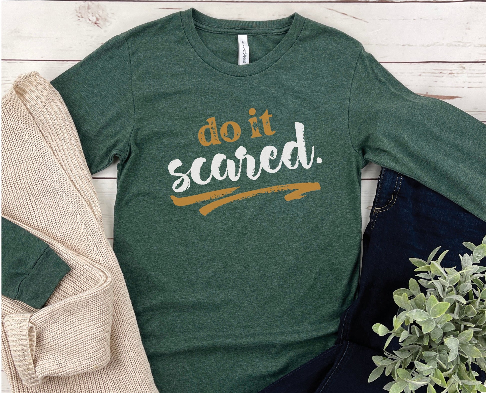 Do It Scared faith over fear 2 Timothy 1:7 do not fear bible verse Christian aesthetic design printed in white and gold on soft heather forest green unisex long sleeve tee shirt for women and men