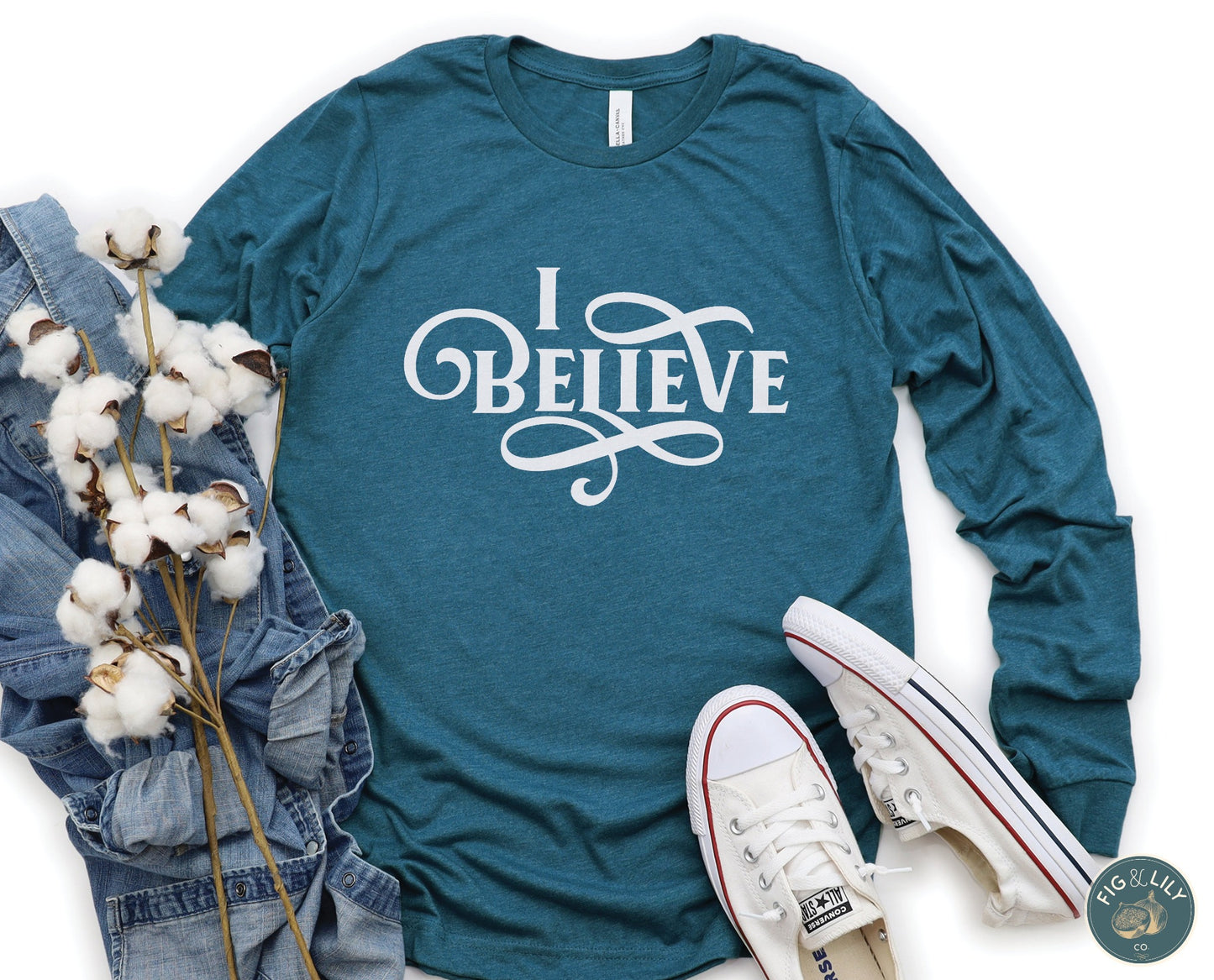 I Believe Swirl Christian aesthetic Jesus believer design printed in white on soft heather deep teal long sleeve tee for women