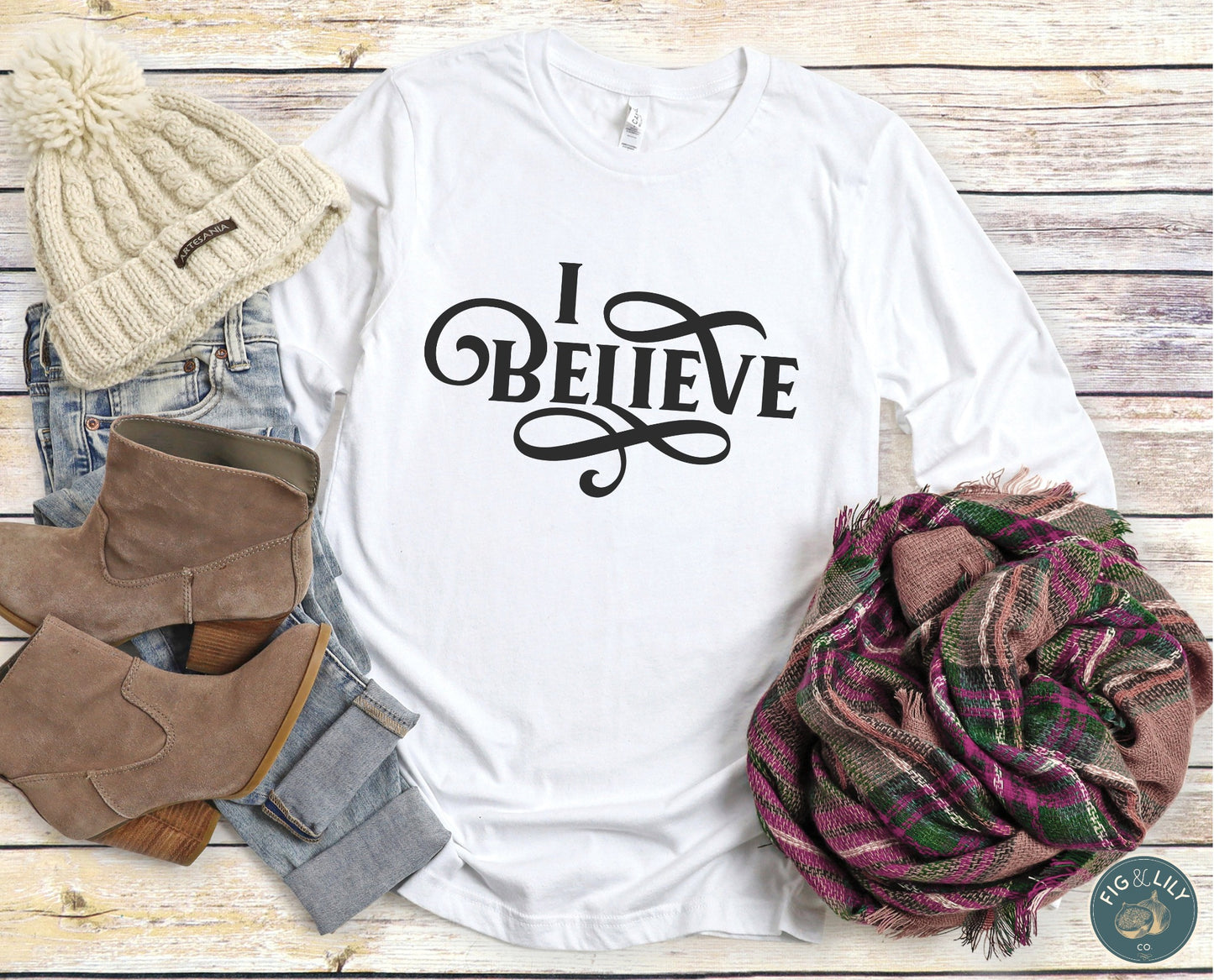 I Believe Swirl Christian aesthetic faith statement design printed in black on soft white cozy long sleeve tee for women