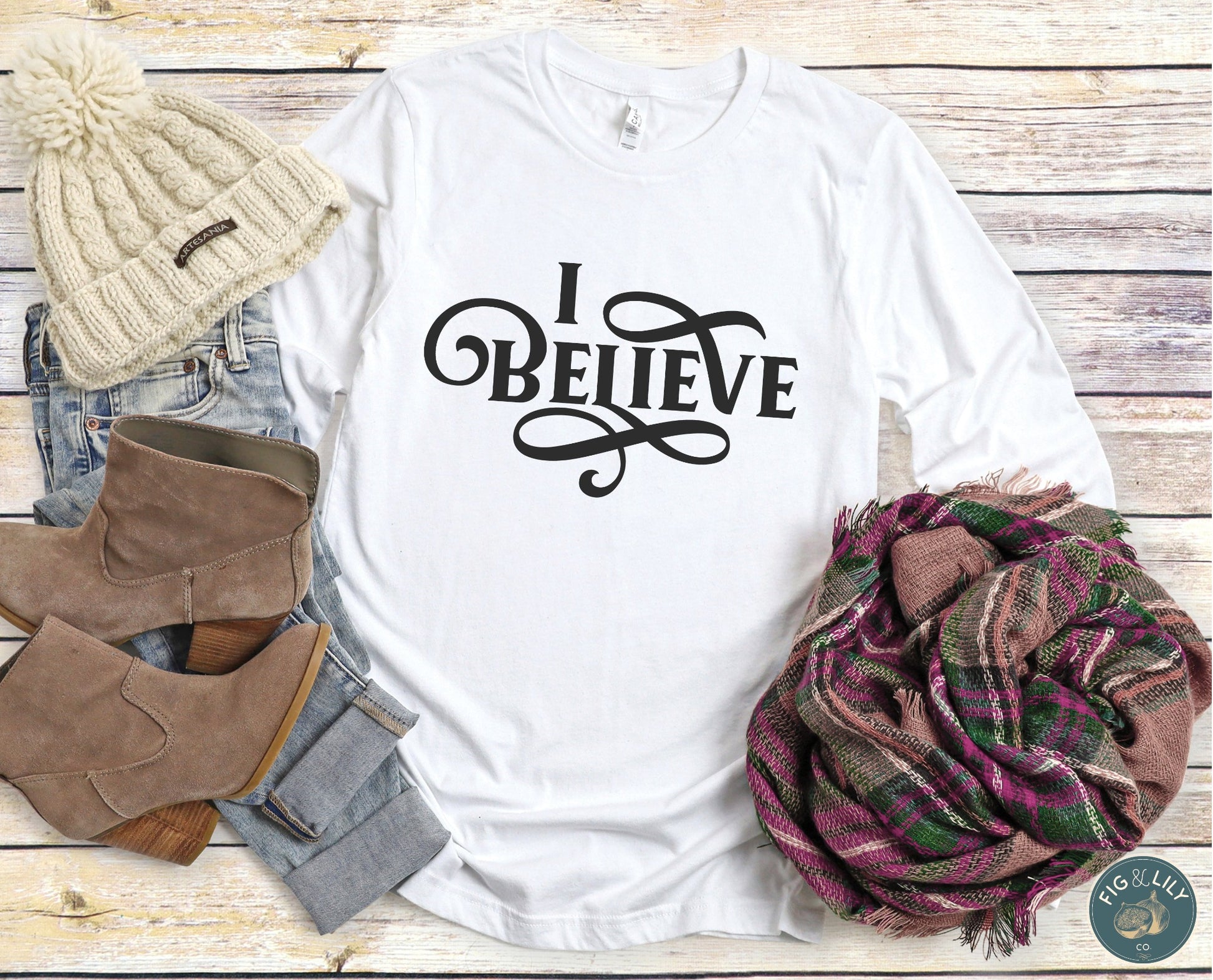 I Believe Swirl Christian aesthetic faith statement design printed in black on soft white cozy long sleeve tee for women