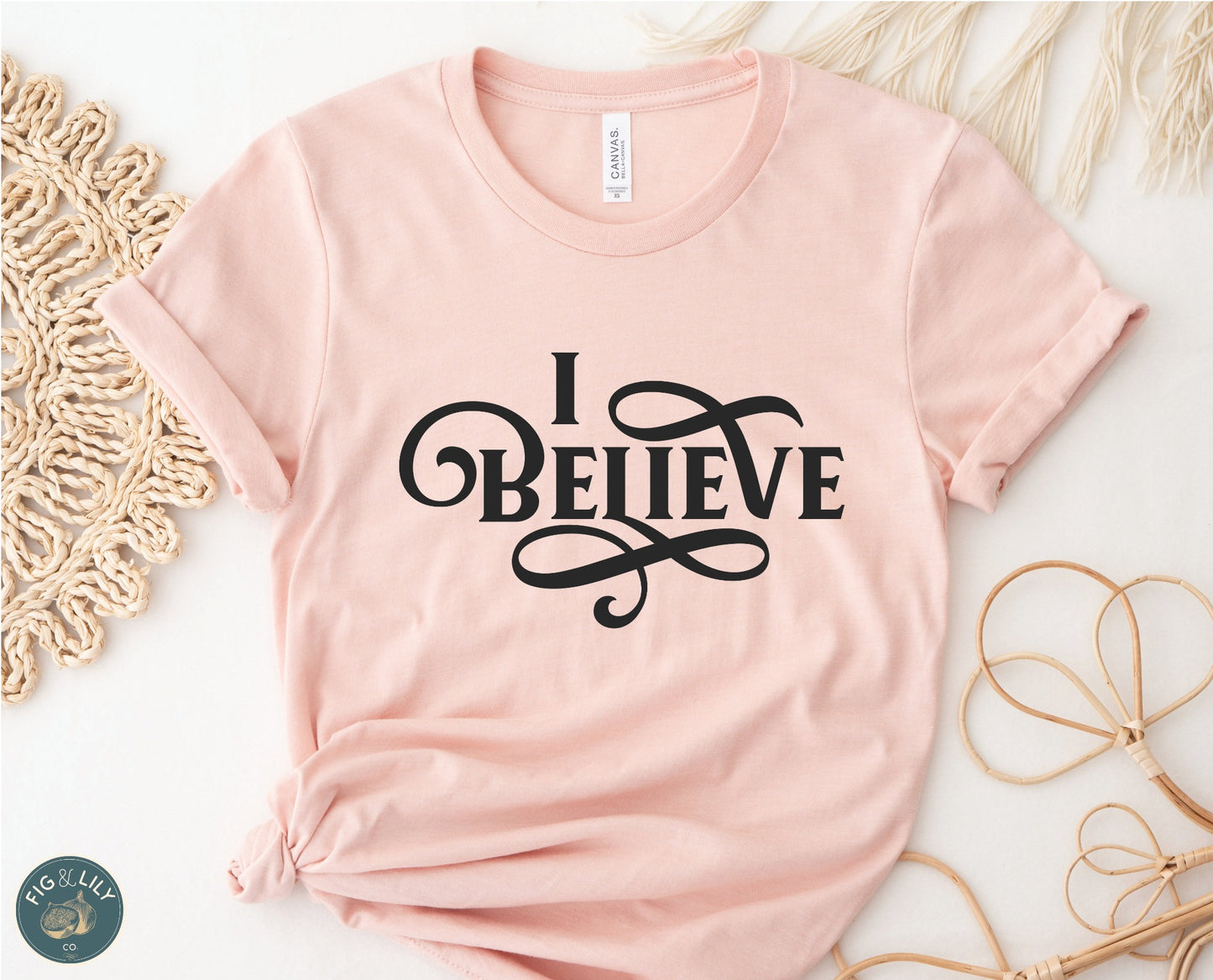 I Believe Swirl Christian aesthetic Jesus believer t-shirt design printed in black on soft heather prism peach tee for women, great gift for her