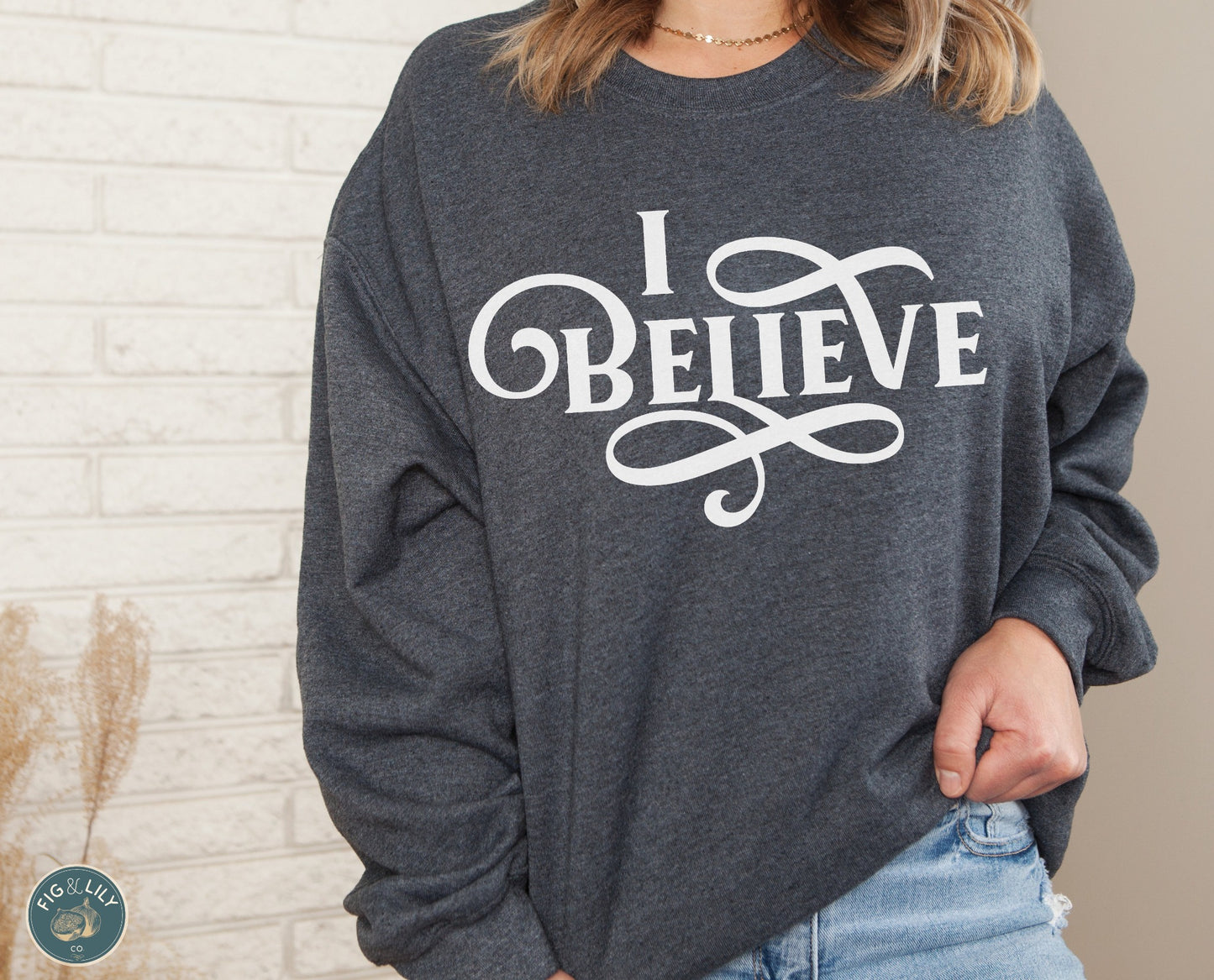 I Believe Swirl Christian aesthetic Jesus believer design printed in white on soft heather dark gray unisex crewneck sweatshirt for women, great gift for her