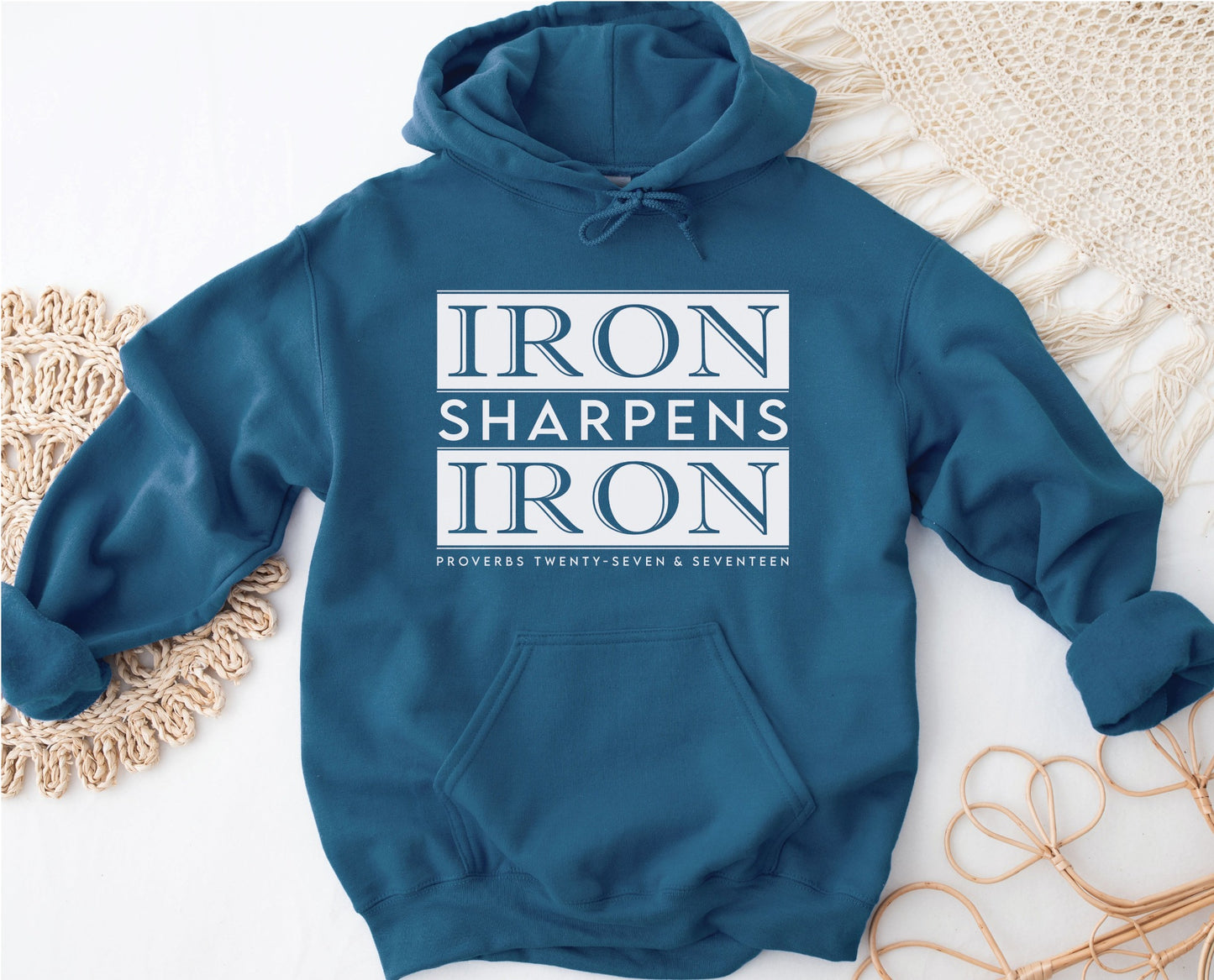 Iron Sharpens Iron Proverbs 27:17 Bible Verse Christian aesthetic faith-based hoodie with bold white design printed on cozy indigo blue unisex hoodie sweatshirt for men and women