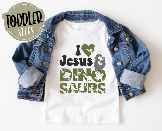 I Love Jesus and Dinosaurs cute Christian aesthetic soft toddler size kids t-shirt for boys in white, black, heather gray, and navy blue