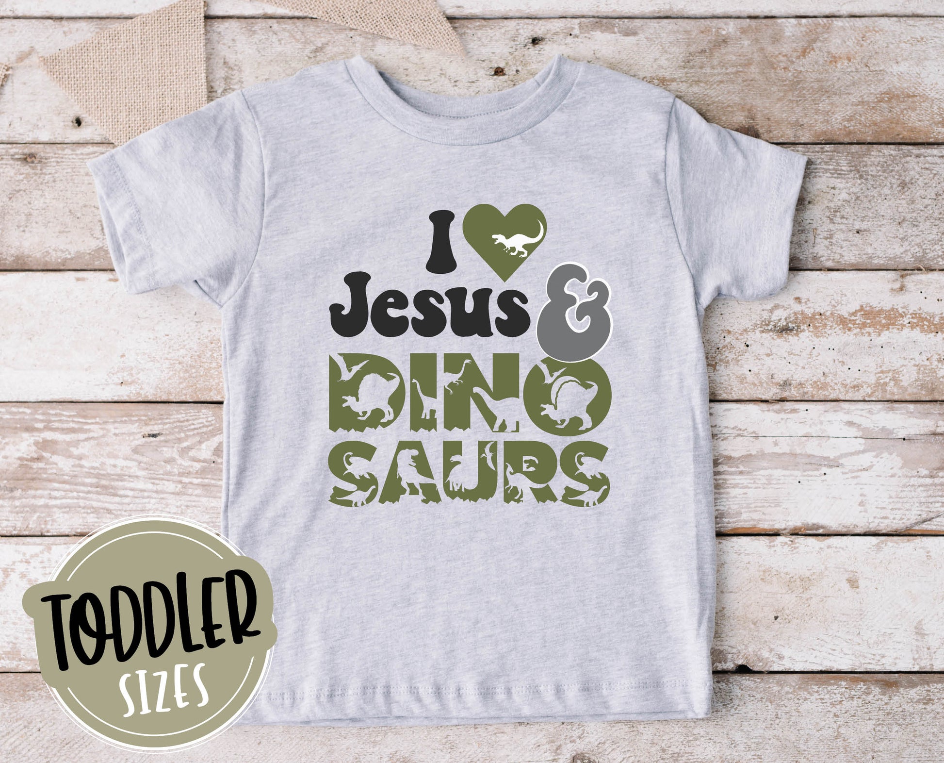 I Love Jesus and Dinosaurs cute Christian aesthetic soft toddler size kids t-shirt for boys in white, black, heather gray, and navy blue