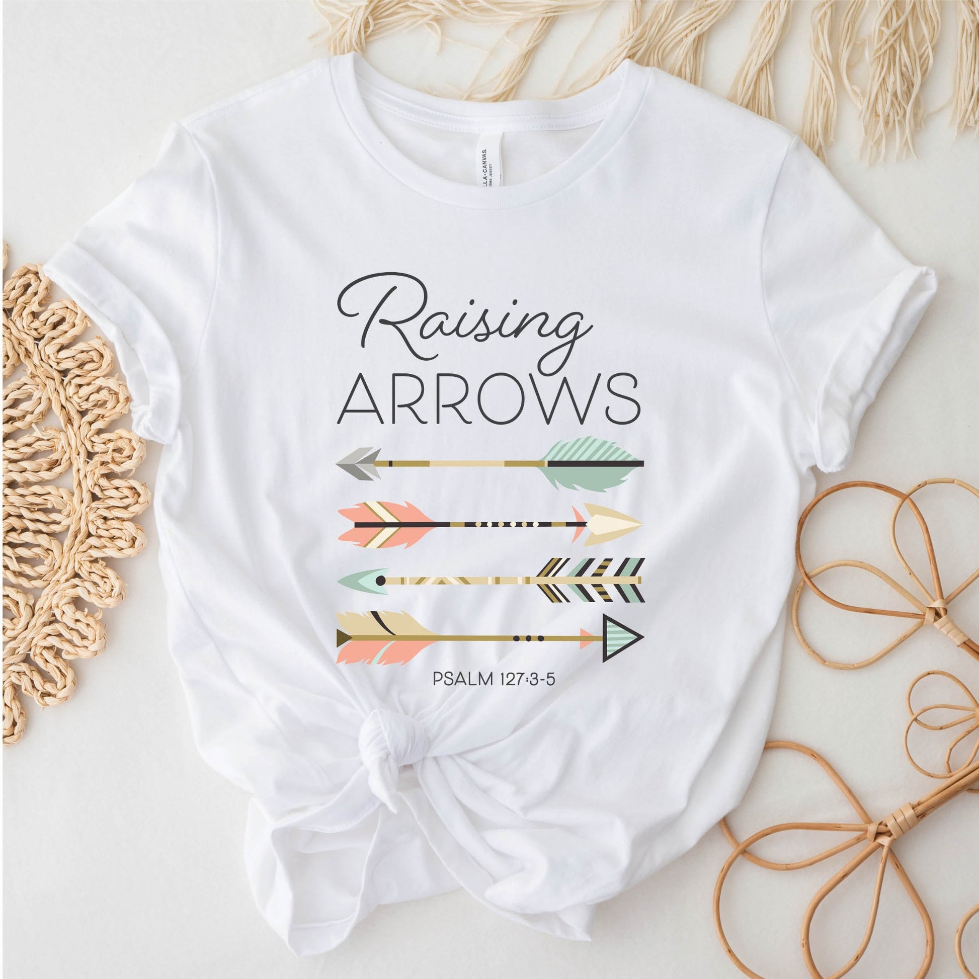 Boho Raising Arrows Psalm 127 Quiver Full Christian aesthetic faith-based design printed in peach, cream, light teal, gold dark gray on soft white unisex t-shirt for women and Moms