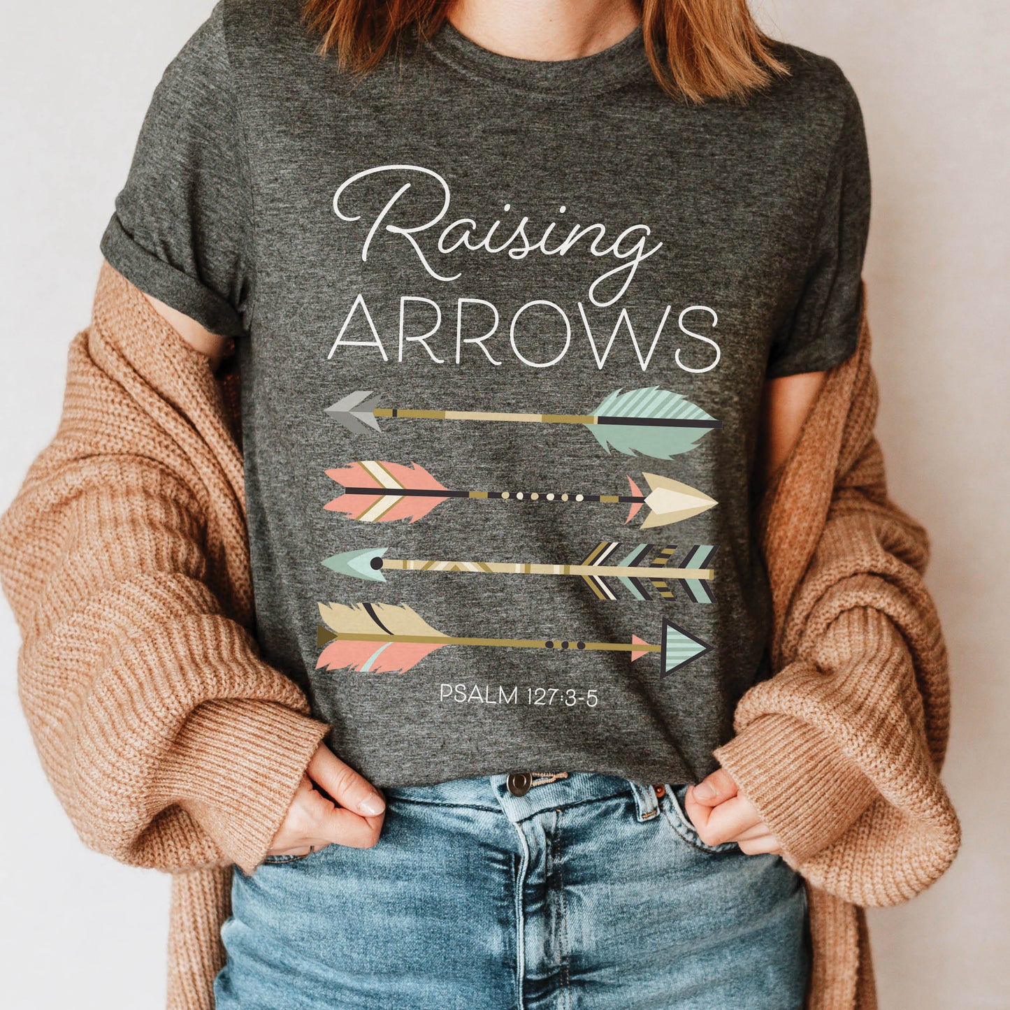 Boho Raising Arrows Psalm 127 Quiver Full Christian aesthetic faith-based design printed in peach, cream, light teal, gold on heather dark gray unisex t-shirt for women and Moms