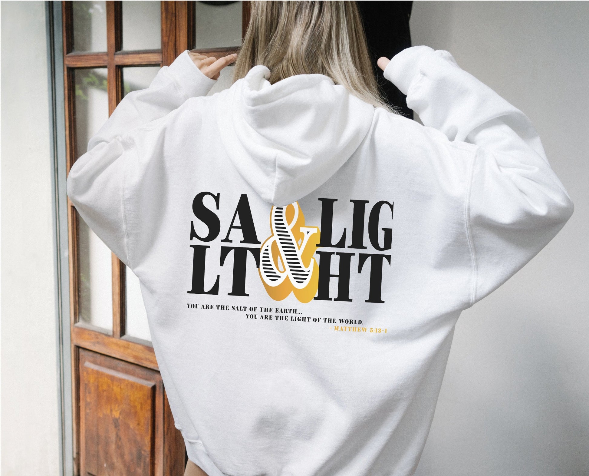 Retro Stacked Salt And Light Matthew 5 Christian bible verse design printed on front and back in black and gold on cozy white unisex hoodie for men and women