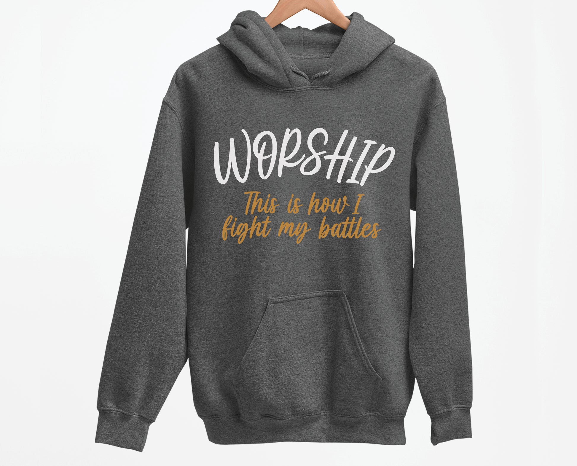 Worship This Is How I Fight My Battles Christian aesthetic design printed in white and gold on cozy heather dark gray unisex hoodie for women and men, great gift for worship leaders