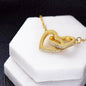 Interlocking hearts 18K gold necklace gift for Mom with navy blue and pink watercolor message card that says "To My Incredible Mom", perfect present for Mother's Day, in jewelry gift box