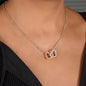 Woman wearing interlocking hearts rose and white gold necklace gift for Mom with navy blue and pink watercolor message card that says "To My Incredible Mom", perfect present for Mother's Day, in luxury LED light jewelry gift box