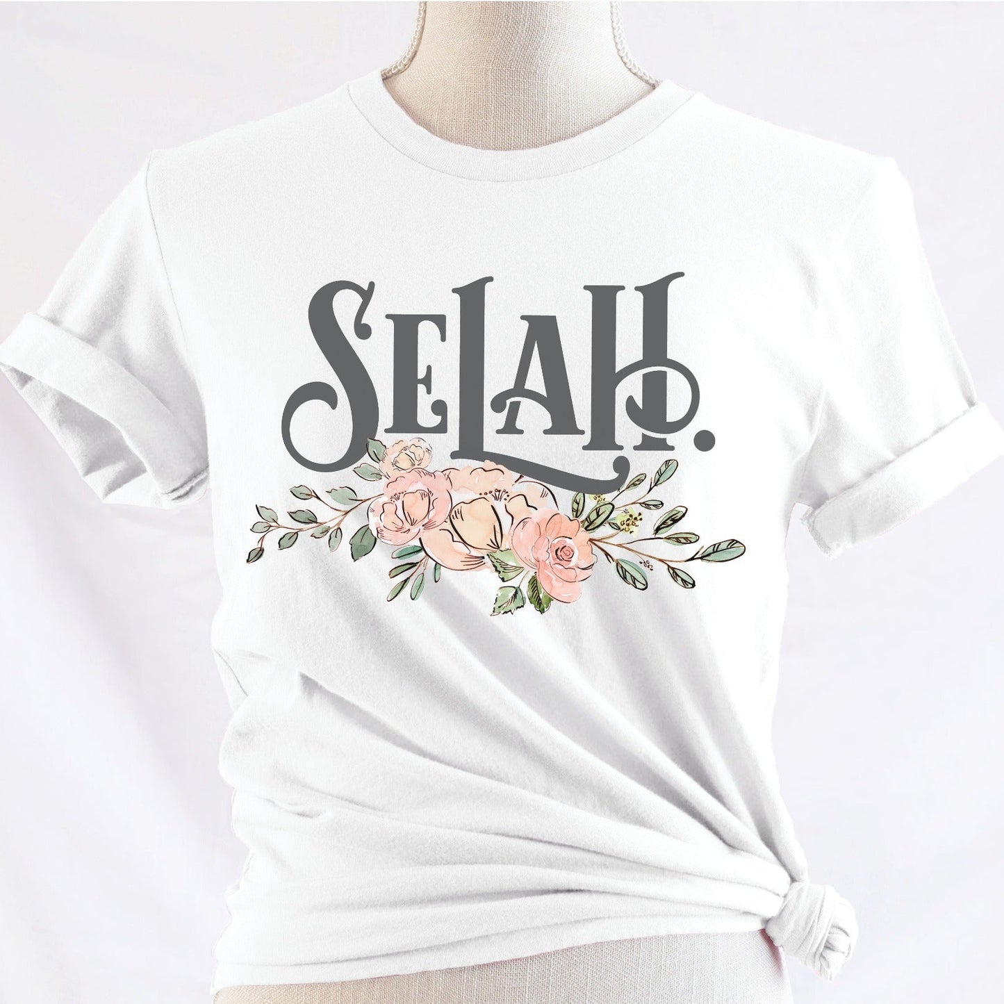 Selah Psalm bible verse watercolor floral Christian aesthetic design printed in charcoal gray, peach, blush pink, on soft white t-shirt for women