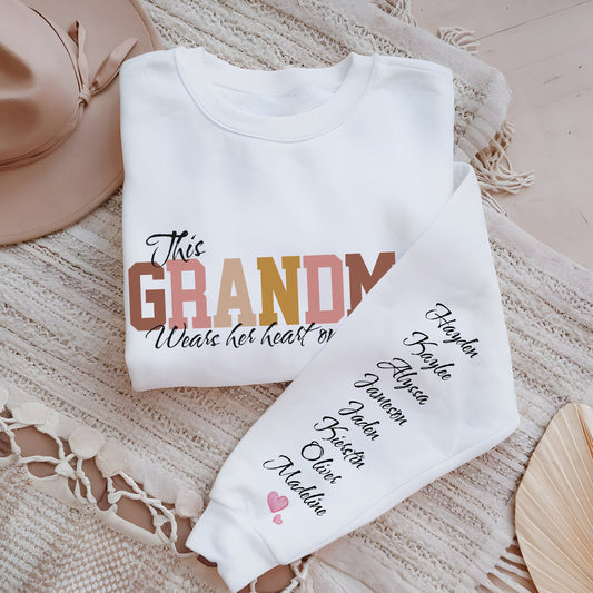 Personalized This GRANDMA Wears Her Heart On Her Sleeve Grandchildren names sleeve print white cozy trendy women's sweatshirt gift for Christmas, birthday or Mother's day