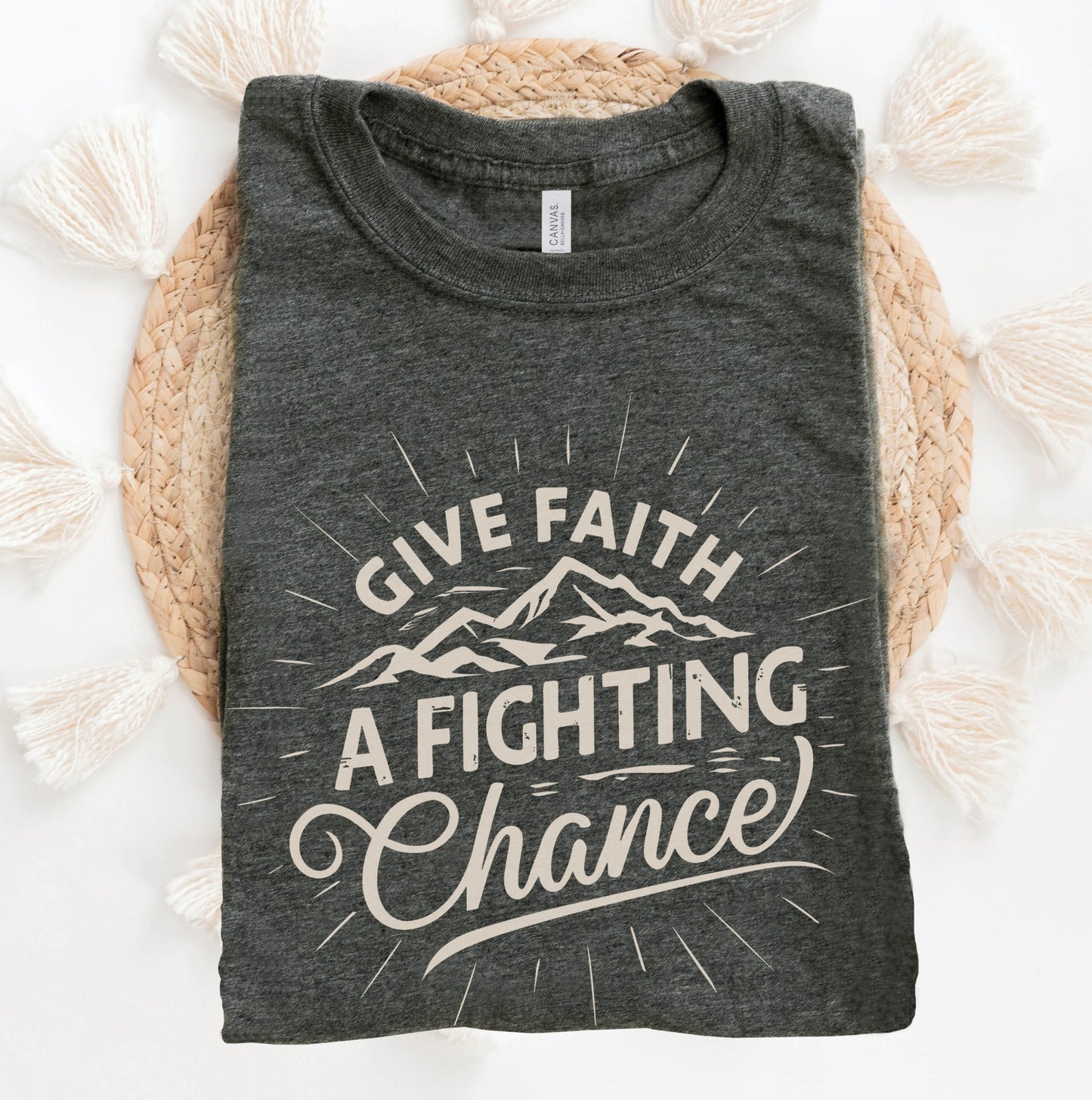 Heather Dark Gray Unisex Tee with Christian Bible verse quote that says, "Give Faith A Fighting Chance" with retro sunburst and mountain graphics, designed for faith-based men and women