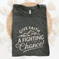 Heather Dark Gray Unisex Tee with Christian Bible verse quote that says, "Give Faith A Fighting Chance" with retro sunburst and mountain graphics, designed for faith-based men and women
