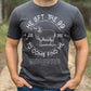 Man wearing a heather dark gray Christian unisex t-shirt with He Left the 99 to Come Find Me Jesus Christ Luke 15 bible verse and vintage sheep illustration graphic and distressed text printed in white