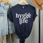 Coziness vibes boho chic Navy Blue "Hygge Life" quote Holy Hygge Women's unisex Christian t-shirt with Scandinavian floral and heart art for the cozy fall and winter season