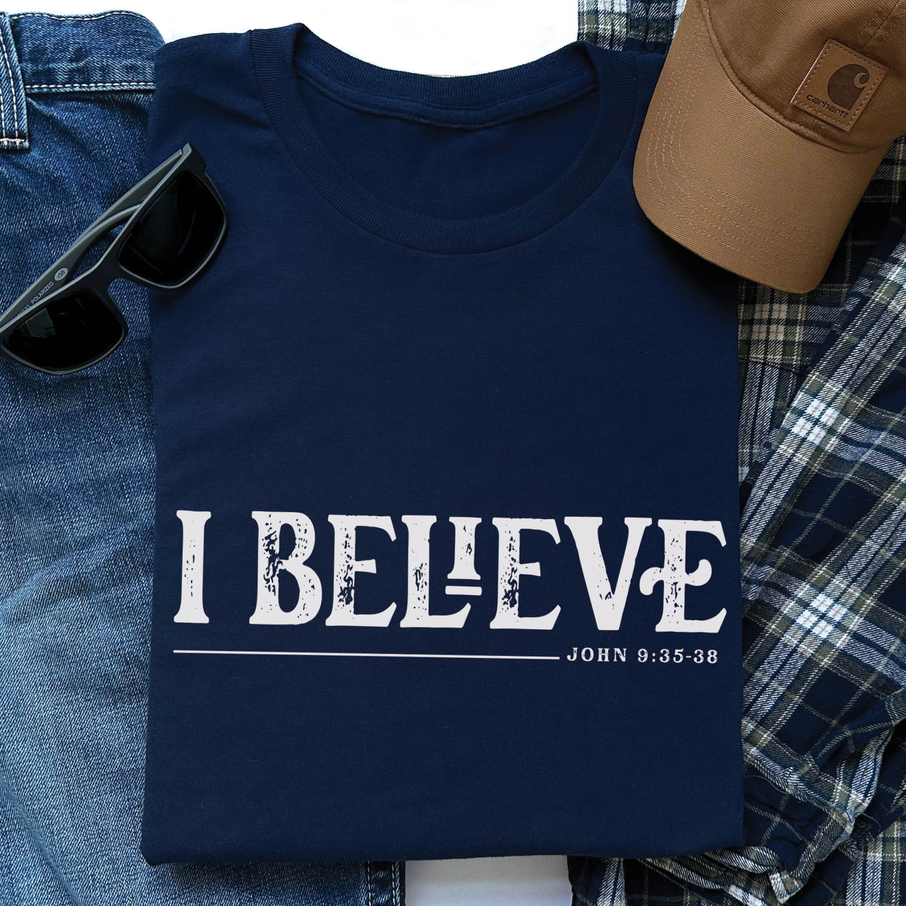 Navy blue unisex Christian t-shirt featuring distressed 'I Believe - John 9:35-38' Bible verse print in white, perfect for men and women expressing their faith