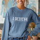 Indigo blue unisex long sleeve unisex Christian t-shirt featuring distressed 'I Believe - John 9:35-38' Bible verse print, perfect for men and women expressing their faith