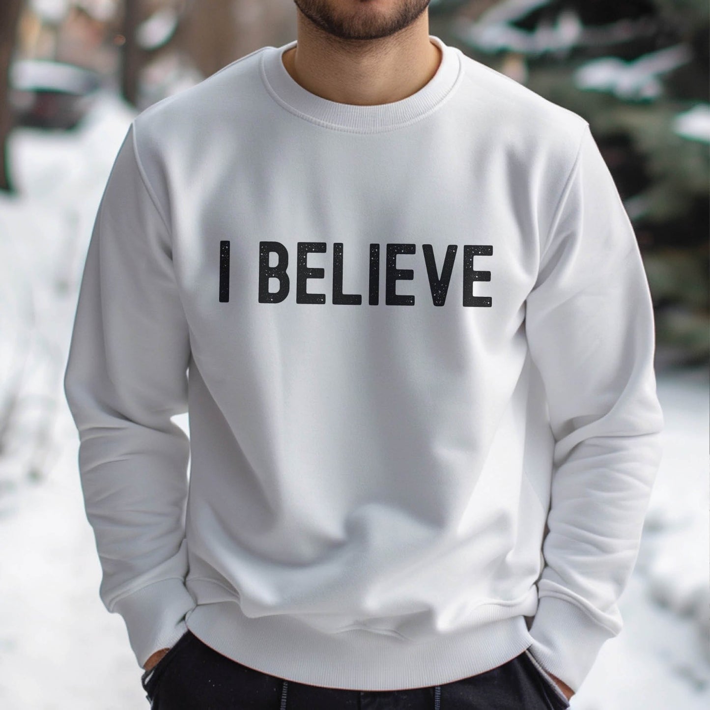 Man wearing an "I Believe" Christian aesthetic Jesus believer matte black simple distressed typography design printed on cozy white unisex crewneck sweatshirt, created for men & women