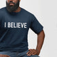 Black man wearing an I BELIEVE Christian aesthetic faith-based bold statement distressed typography t-shirt design printed in white on soft navy blue unisex fit t-shirt, designed for men & women believers