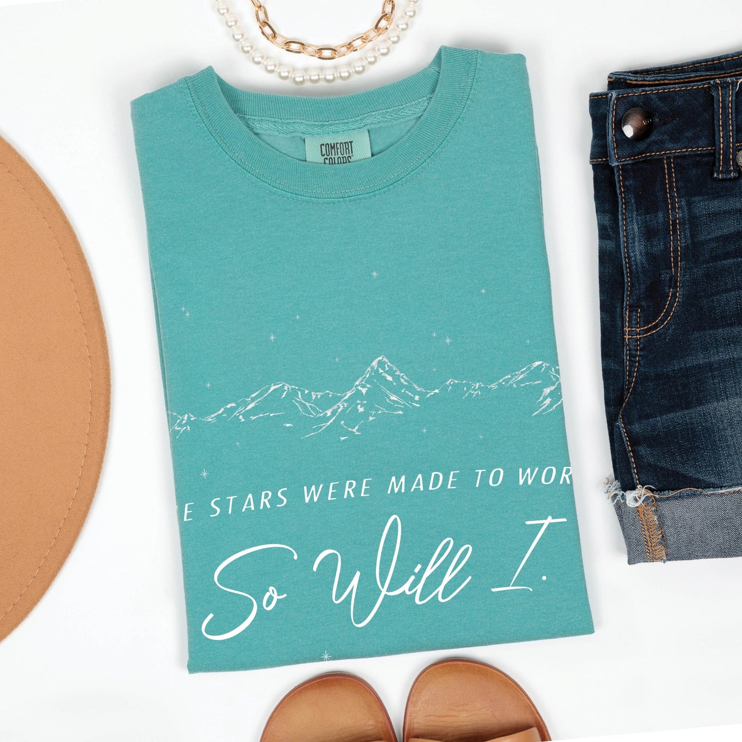 Seafoam teal color Christian unisex Comfort Colors 1717 t-shirt with a white hand-drawn mountain range and starry sky that says this faith-based bible verse quote, "If the Stars Were Made to Worship So Will I", created for men and women Kingdom believers