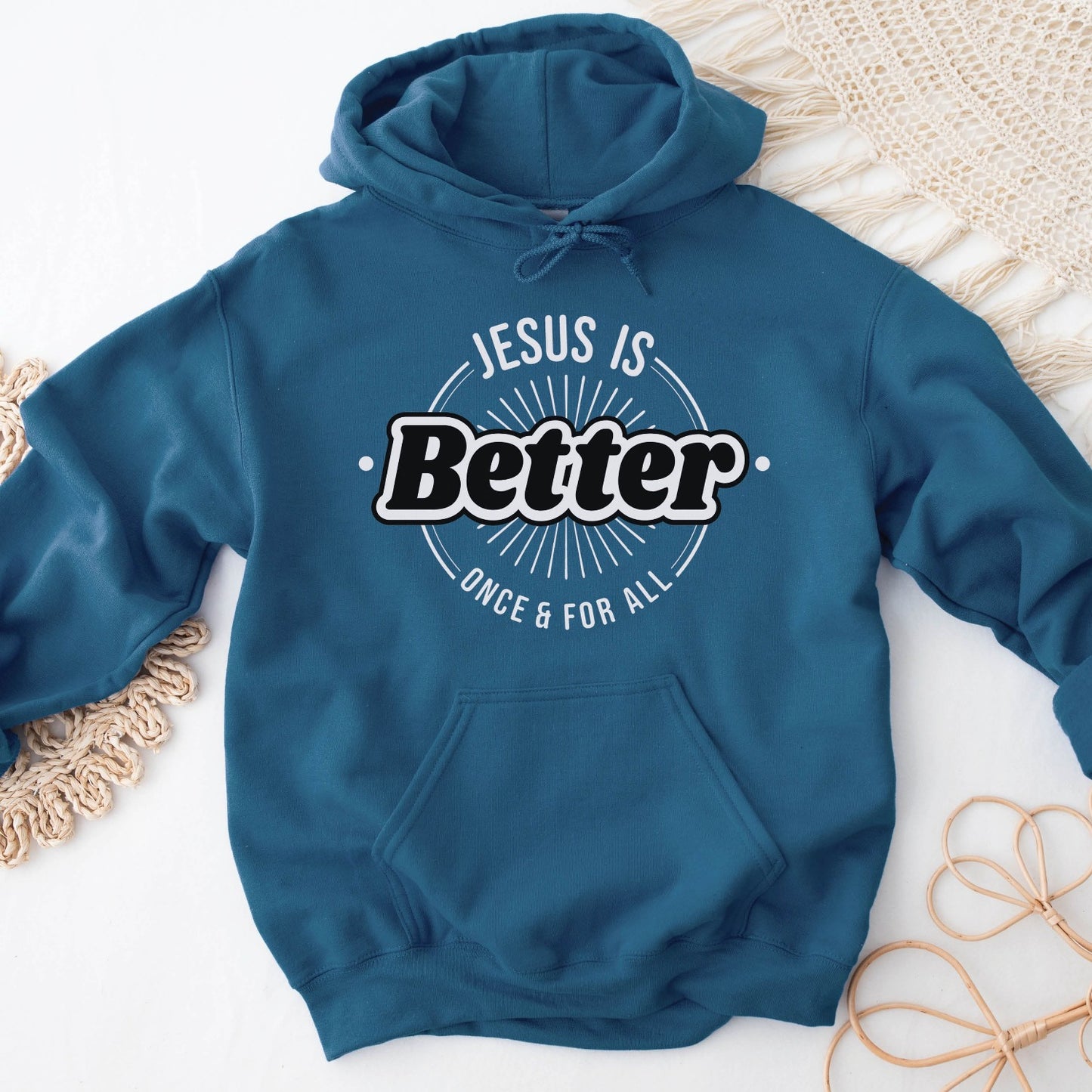 Indigo teal blue color faith-based oversized cozy hoodie sweatshirt with "Jesus is BETTER - Once and For All" logo style design in black and white, created for Christian men and women