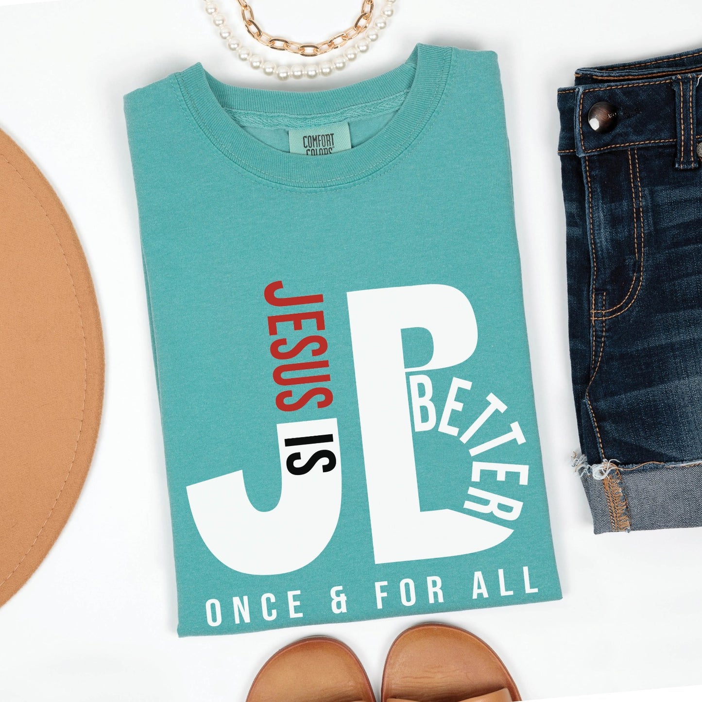 Folded Seafoam Bright Teal color JB typography Jesus is Better Once and For All Christian book of Hebrews Unisex Comfort Colors C1717 t-shirt, created for faith-based women and men