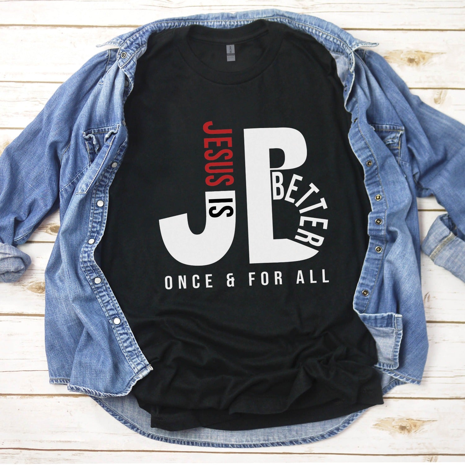 Men's "JB" typography "Jesus is Better Once and For All" design in white and red letters, based on the Christian bible book of Hebrews, printed on a black color Unisex t-shirt, created for faith-based men and women, great father's day dad gift for him