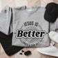 Heather sport gray color faith-based cozy sweatshirt with "Jesus is BETTER - Once and For All" logo style design in black, created for Christian men and women