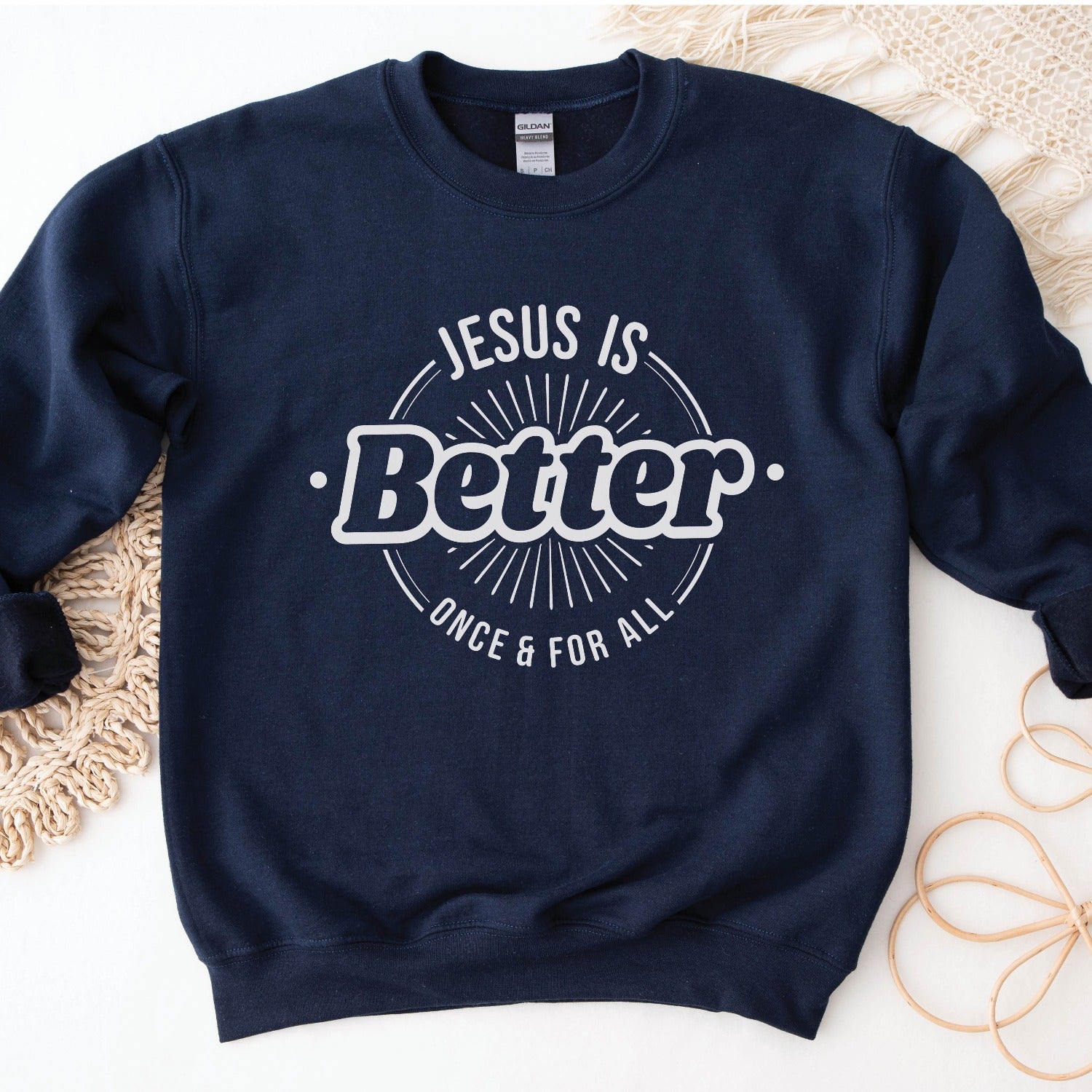 Navy blue color faith-based cozy sweatshirt with "Jesus is BETTER - Once and For All" logo style design in white, created for Christian men and women