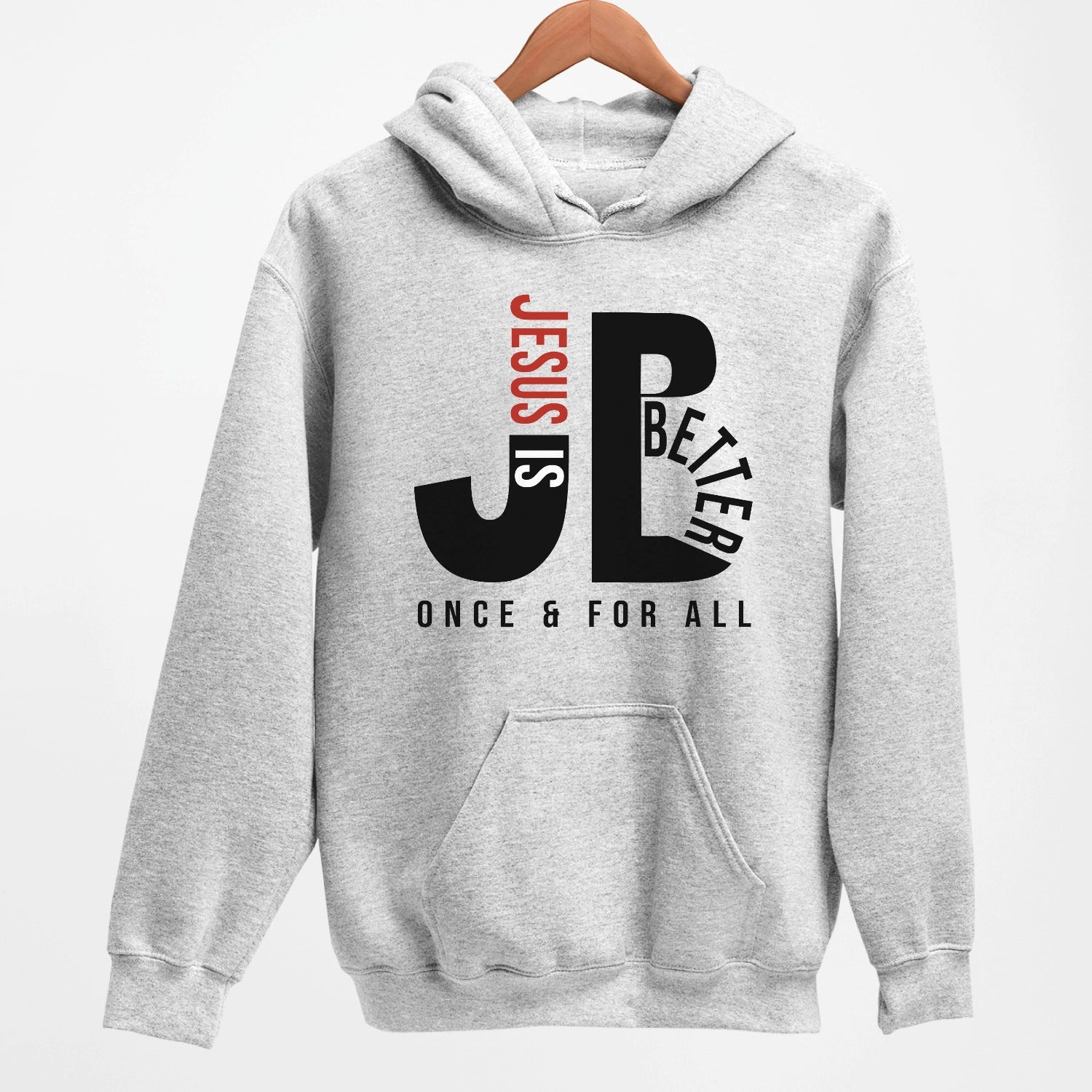 Cozy "JB" typography "Jesus is Better Once and For All" design in black and red letters, based on the Christian bible book of Hebrews, printed on a heather sport gray color unisex hoodie, created for faith-based men and women