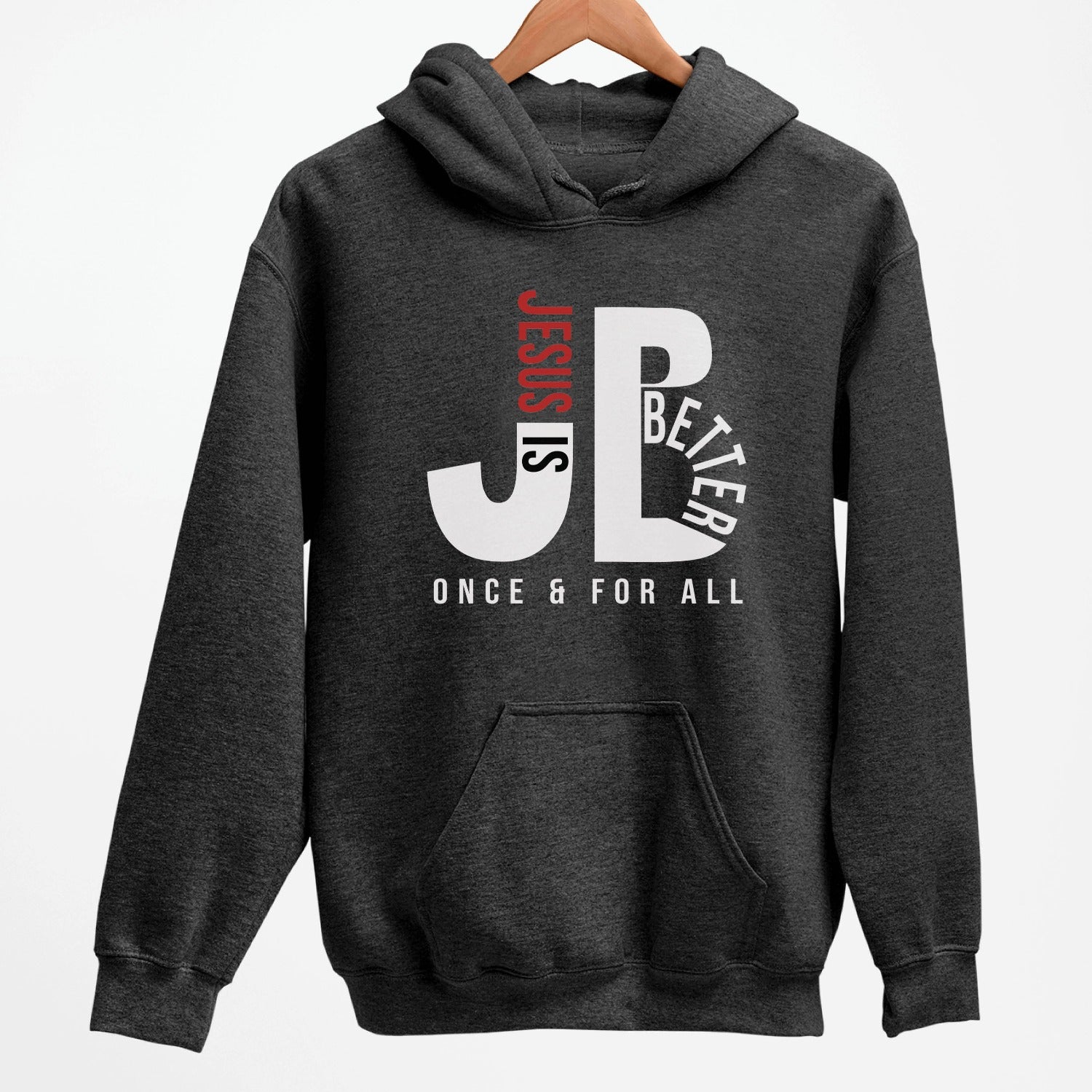 "JB" typography "Jesus is Better Once and For All" design in white and red letters, based on the Christian bible book of Hebrews, printed on a heather dark gray color cozy unisex hoodie, created for faith-based men and women, great father's day gift for Dad
