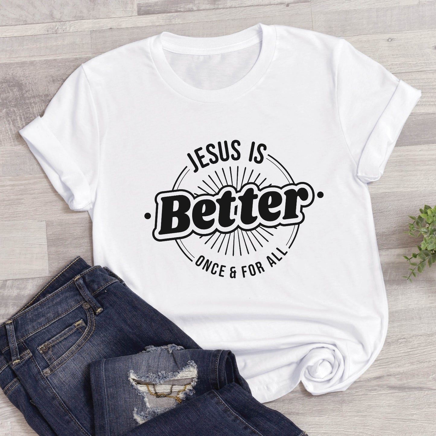 White "Jesus Is Better - Once & For All" bible book of Hebrews faith-based Christian unisex t-shirt for women with a bold black and white sunburst logo style design