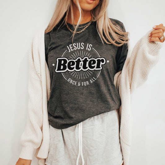 Heather Dark Gray "Jesus Is Better - Once & For All" bible book of Hebrews faith-based Christian unisex t-shirt for women with a bold white and black sunburst logo style design