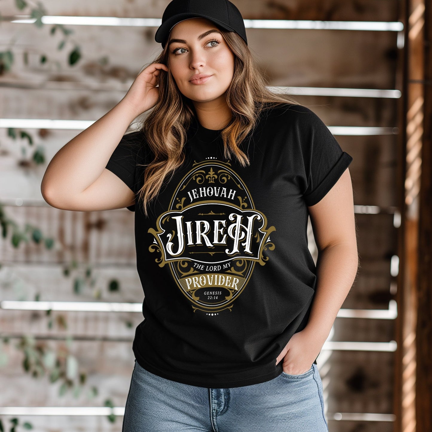 Woman wearing a black Christian faith-based unisex t-shirt featuring a gold ornamental blackletter-style frame design with the text 'Jehovah Jireh The Lord My Provider' and 'Genesis 22:14' Bible verse, unique and inspirational religious apparel for regular and plus size men and women