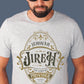 Man wearing a heather gray Christian faith-based unisex t-shirt featuring a gold ornamental blackletter-style frame design with the text 'Jehovah Jireh The Lord My Provider' and 'Genesis 22:14' Bible verse, inspirational statement religious apparel for men and women