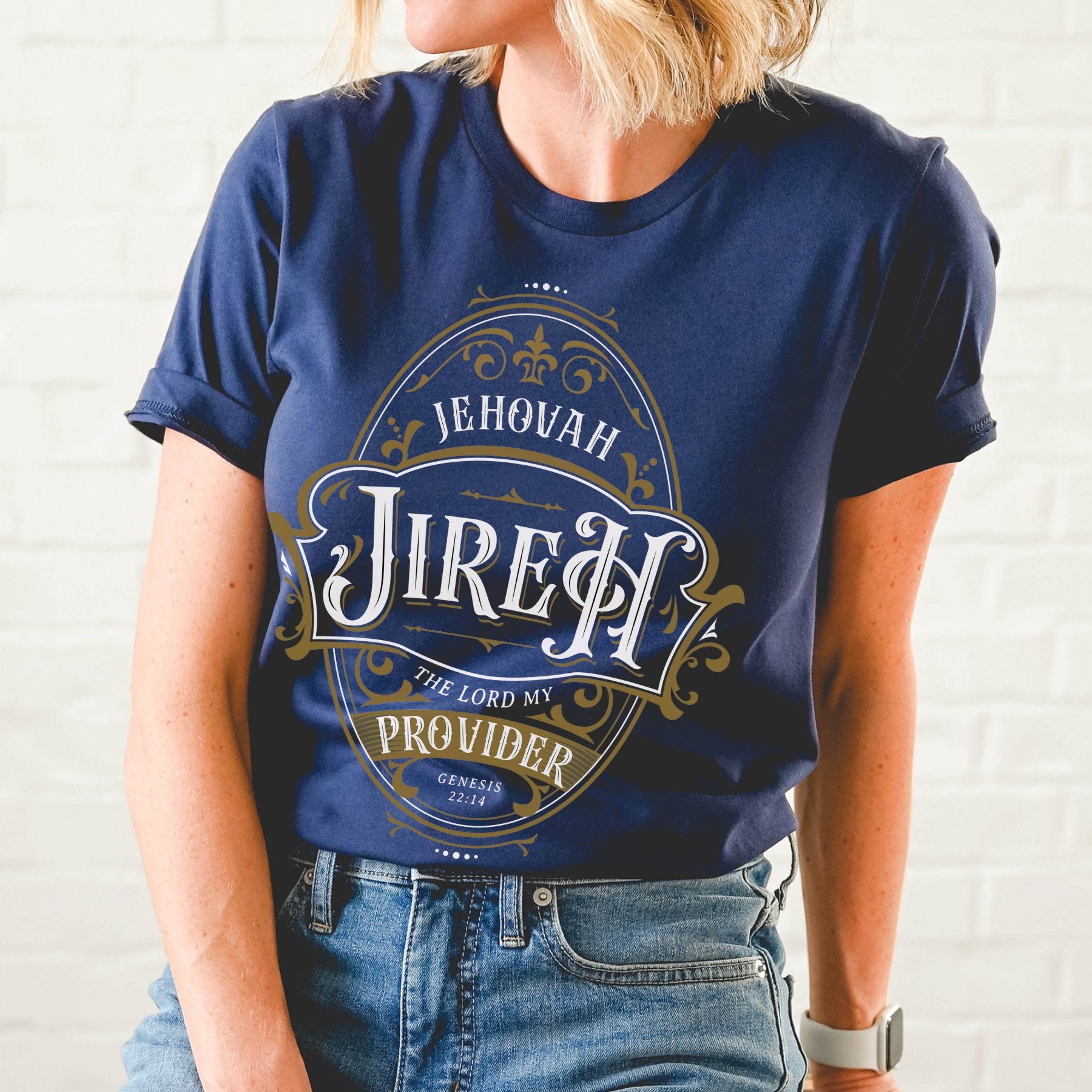 Navy blue and gold Christian faith-based unisex t-shirt featuring a gold ornamental blackletter-style frame design with the text 'Jehovah Jireh The Lord My Provider' and 'Genesis 22:14' Bible verse, inspirational statement religious apparel for men and women