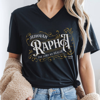 Black V-neck women's Christian t-shirt with 'Jehovah Rapha, The Lord My Healer, Exodus 18:26 bible verse' vintage blackletter style design worn by a woman.
