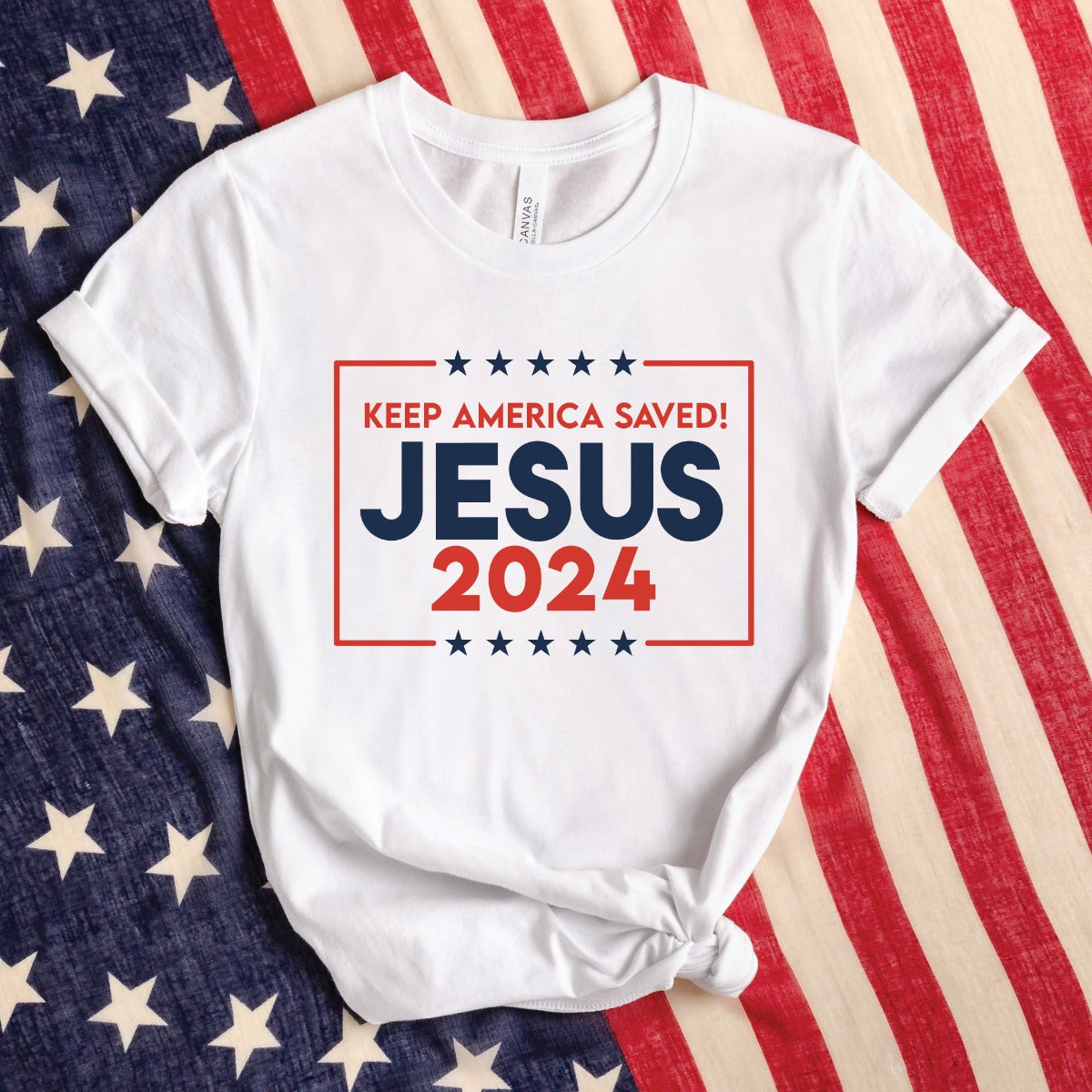 White stars and stripes Presidential election vote unisex Christian t-shirt, Jesus 2024 Keep America Saved" in bold red, white, and blue fonts, made in the USA, made for men and women God & Country Patriots