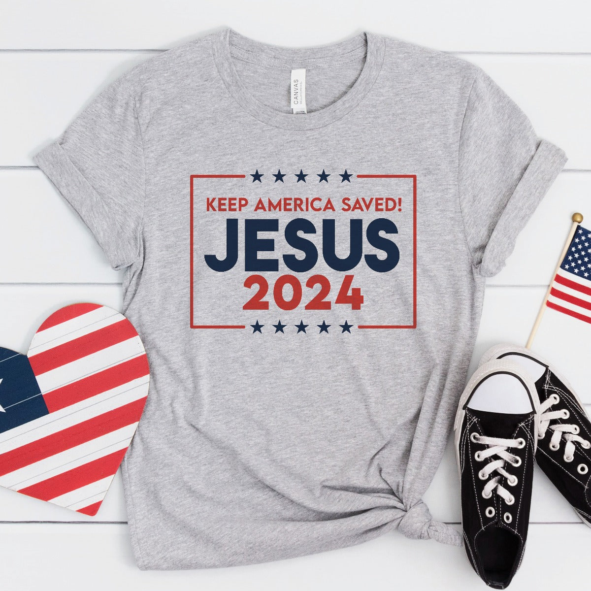 Patriotic athletic heather gray Bella Canvas 3001 Presidential election vote unisex Christian t-shirt with "Jesus 2024 Keep America Saved" printed in bold red, white, and blue fonts, tees made in the USA for men and women God & Country Patriots
