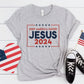 Athletic Heather Gray Patriotic President election vote unisex Christian t-shirt with "Jesus 2024 - Keep America Saved" and stars printed in bold red, white, and blue fonts, made in the USA, made for men and women God & Country Patriots
