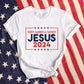 Patriotic soft white Bella Canvas 3001 Presidential election vote unisex Christian t-shirt with "Jesus 2024 Keep America Saved" printed in bold red, white, and blue fonts, tees made in the USA for men and women God & Country Patriots